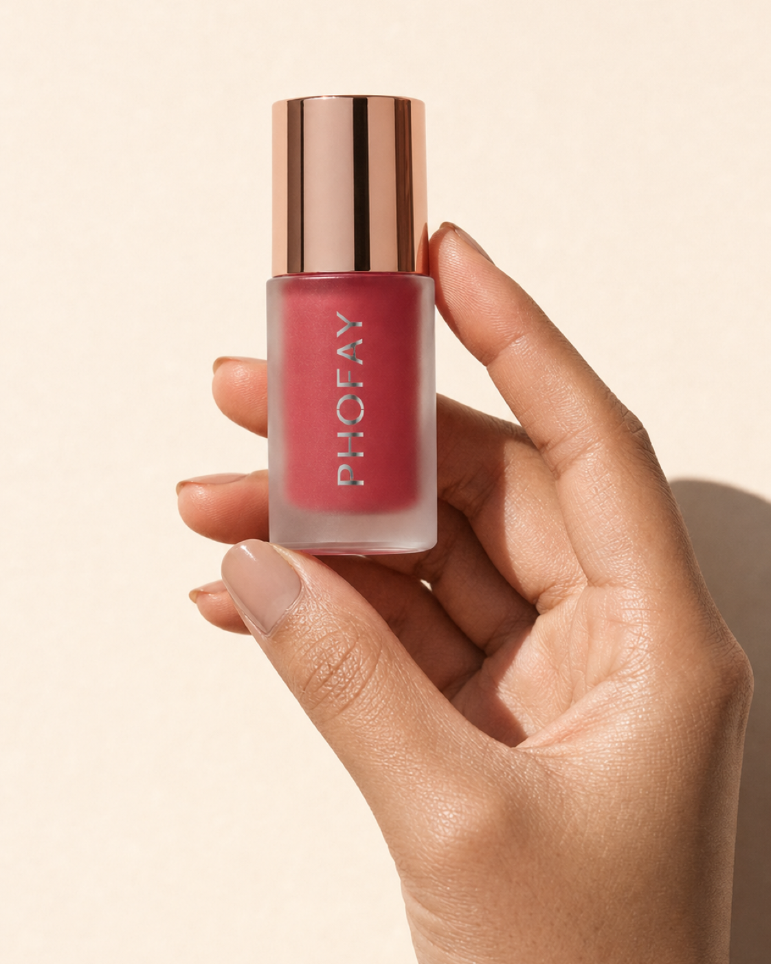 Mousse Blush held in hand for scale