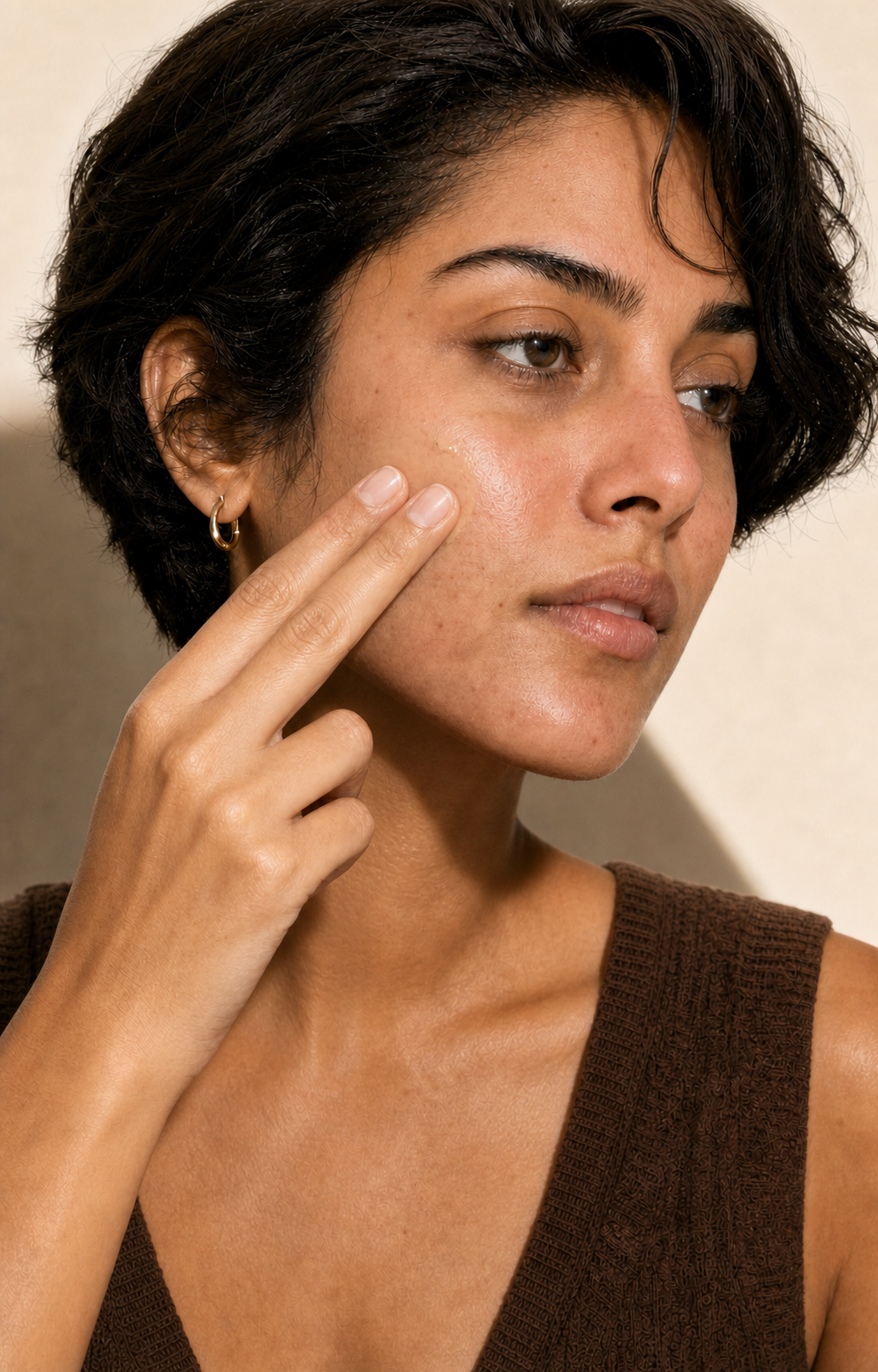 CC Cream being blended over redness with two fingertips